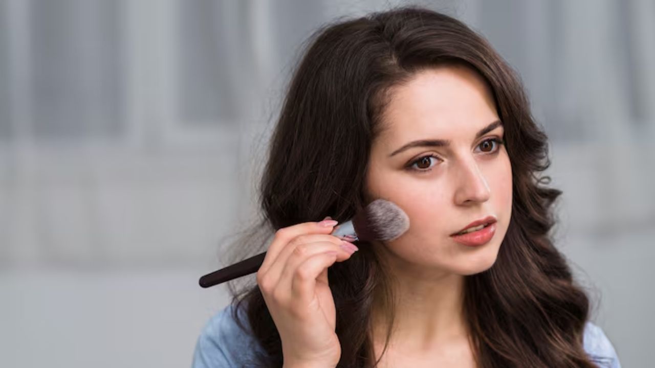 women applying blush