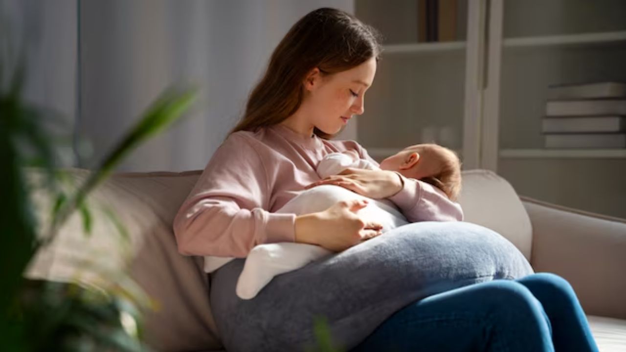 mother feeding milk to baby