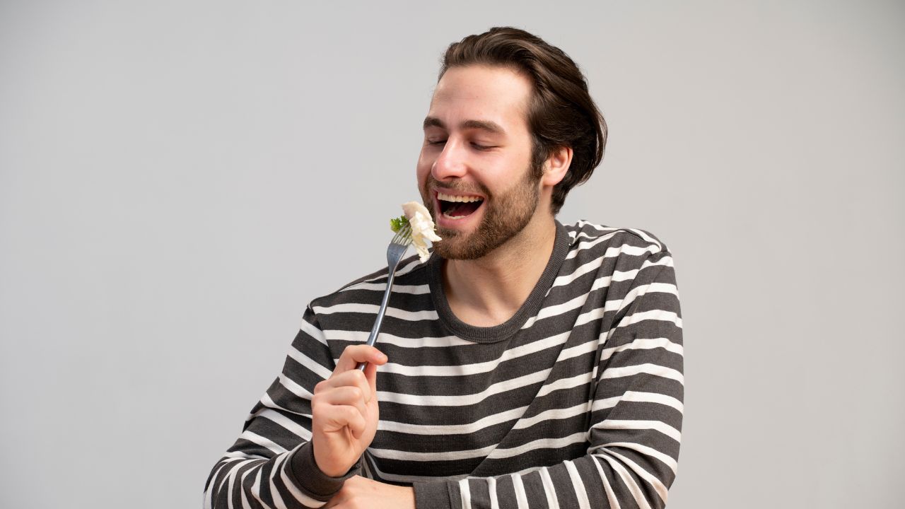 man eating with fork