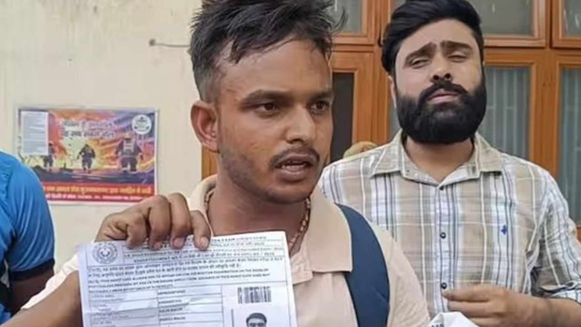 Student Showing his admit card