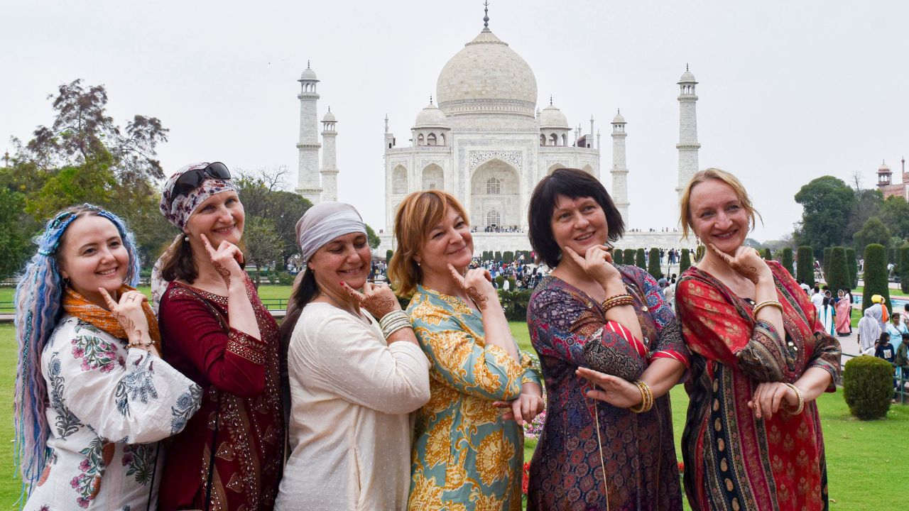 International tourists In front of Taj Mahal