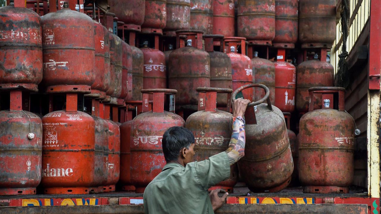 Worker loads LPG gas  cylinders