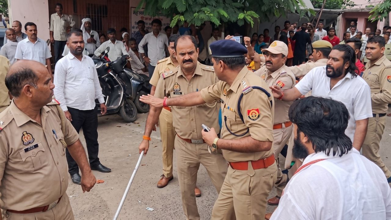 Inspector lathi charge during Agra UGC protests ACP try to stop them