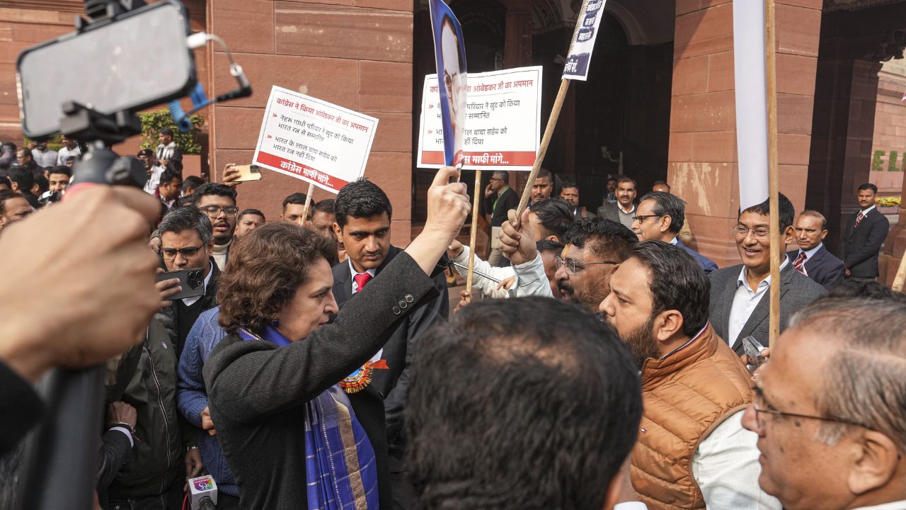 face off between Congress MP Priyanka Gandhi and BJP MP Hemang Joshi during a protest in Parliament. Photo: PTI