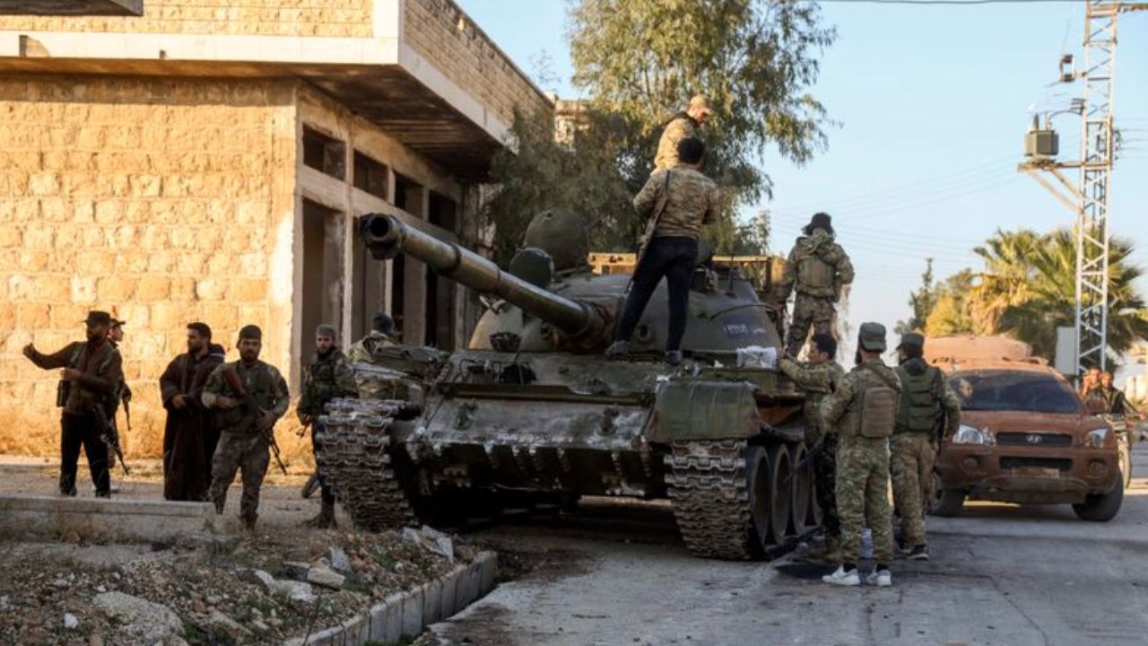 Rebels taking control over a syrian tank : PTI