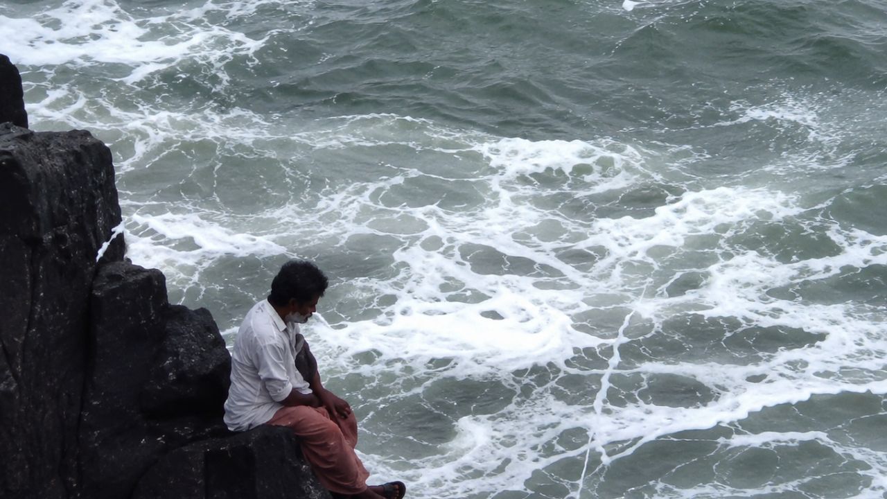 AI Generated Image of a Man Sitting on the Rock