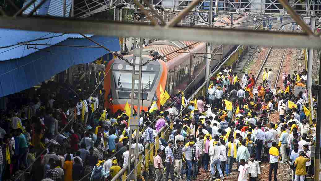 person blockading train। Photo Credit: PTI